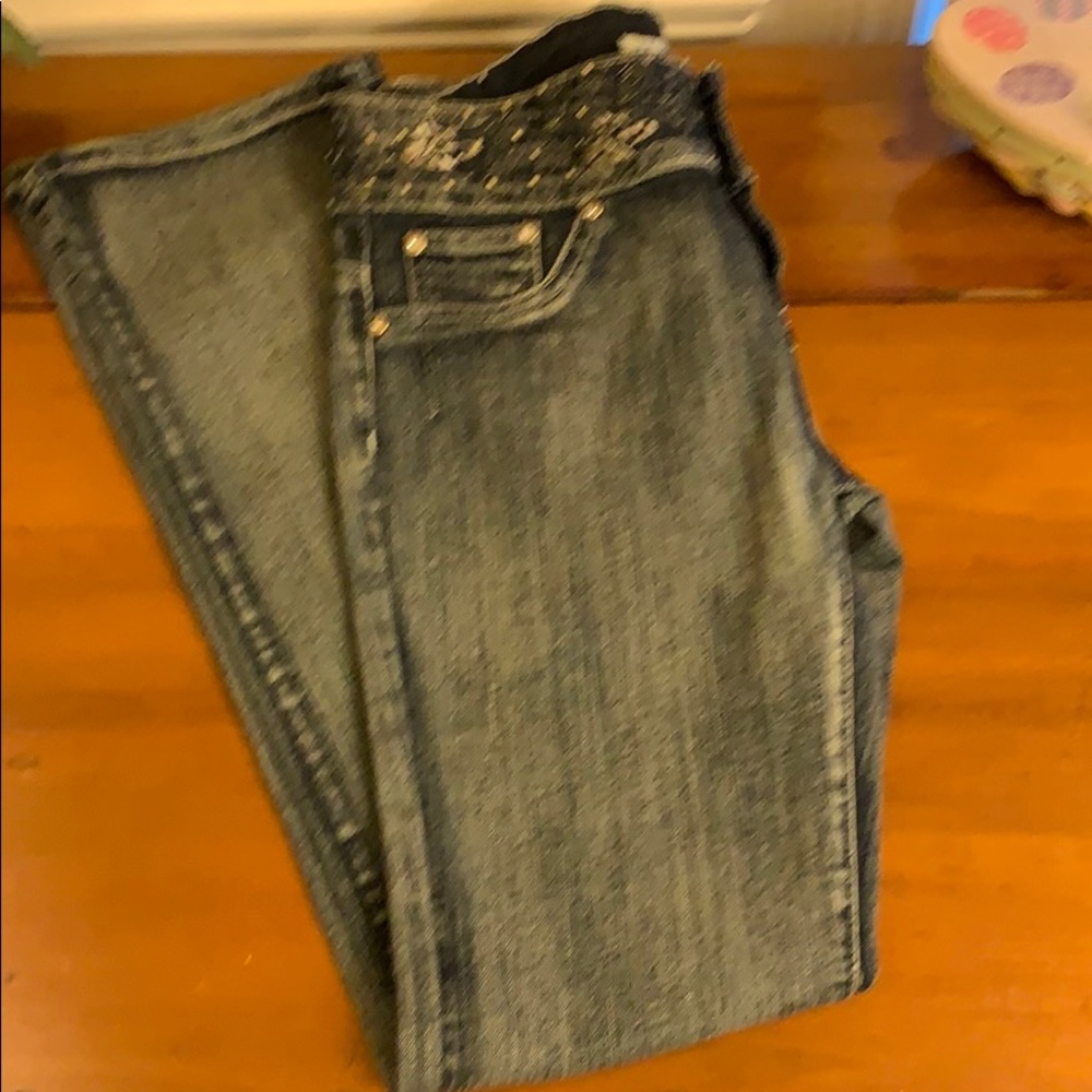 Distressed denim embellished waist jeans